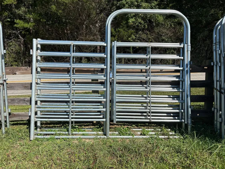 Galvanized 10-foot combo bow gate, half gate and half panel, against a wood fence