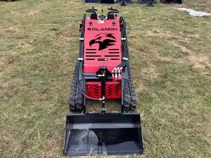 SSL60 mini skid steer, front view with the bucket on the ground