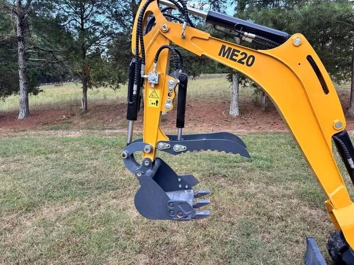 Close-up of the ME20 mini excavator boom, bucket and hydraulic thumb