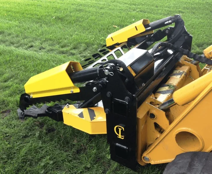 EZ Puller Grapple/Guard Combo on a skid steer, in grass