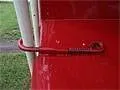 Close-up of a creep feeder panel latch pin