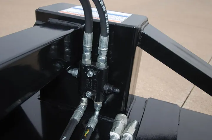Close-up of HD 60 Brush Buster hydraulic hoses and motor mount