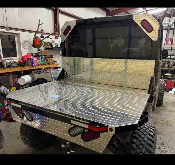 Close-up of the diamond-plate flat bed and headache rack